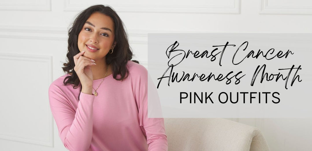 A smiling woman rests her head on her hand and wears a pink Bridget Dolman Bamboo Top in honour of breast cancer awareness month. Title text to the right reads, "Breast Cancer Awareness Month: Pink Outfits".