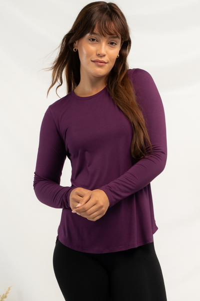 Woman modelling a purple bamboo long sleeve top.