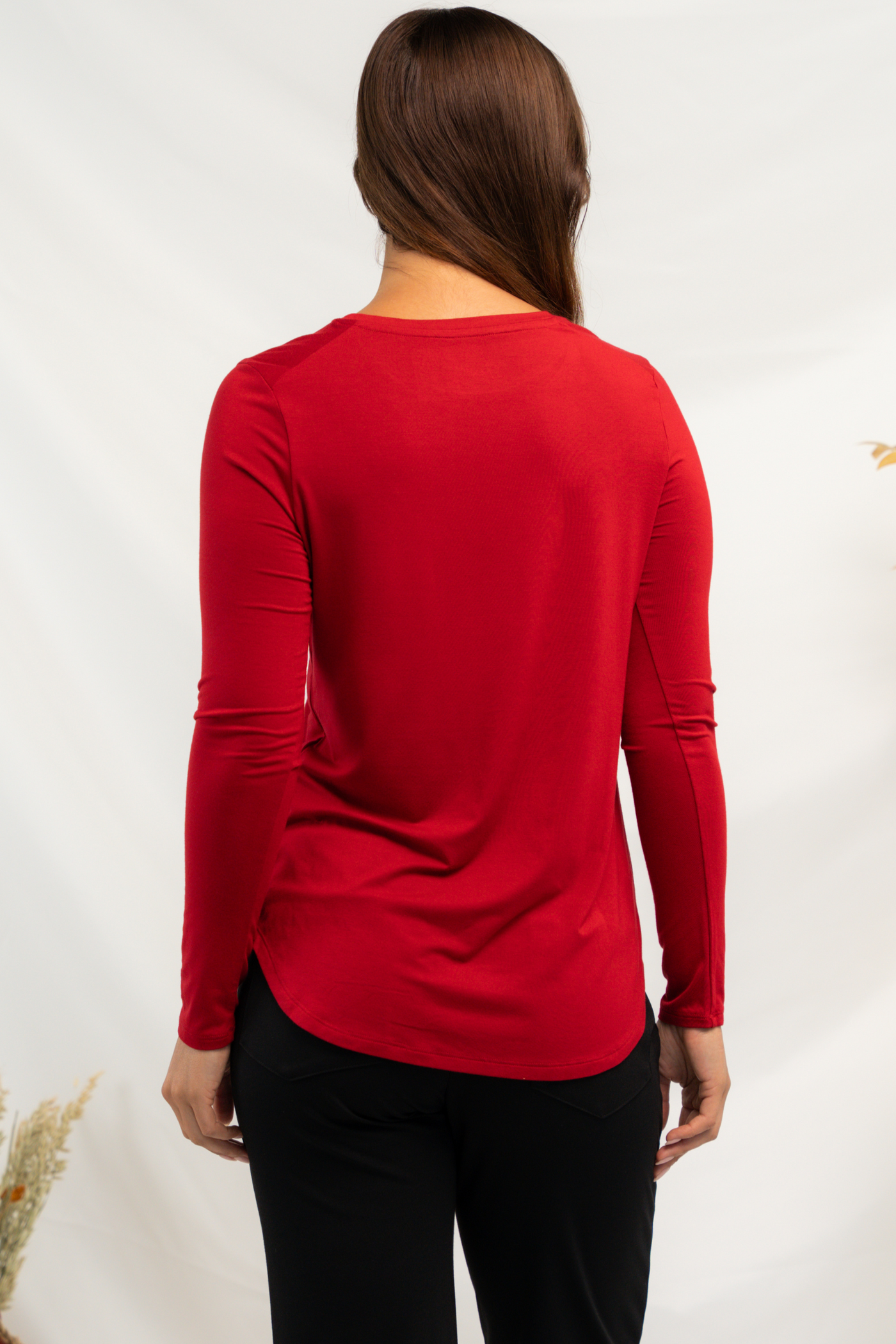 Back view of a women's red bamboo long sleeve top.