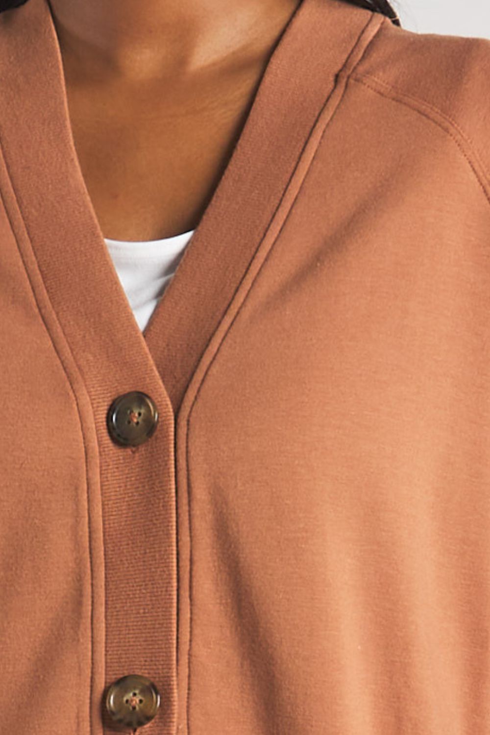 Closeup image of the button details on women’s button-up cardigan made from sustainable bamboo by Terrera.