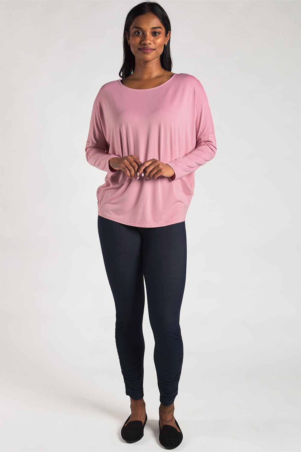 Woman styling a sustainable bamboo dolman sleeve top in Pink by Terrera.
