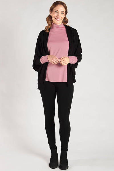 Woman styling a sustainable bamboo funnel-neck long sleeve in Pink