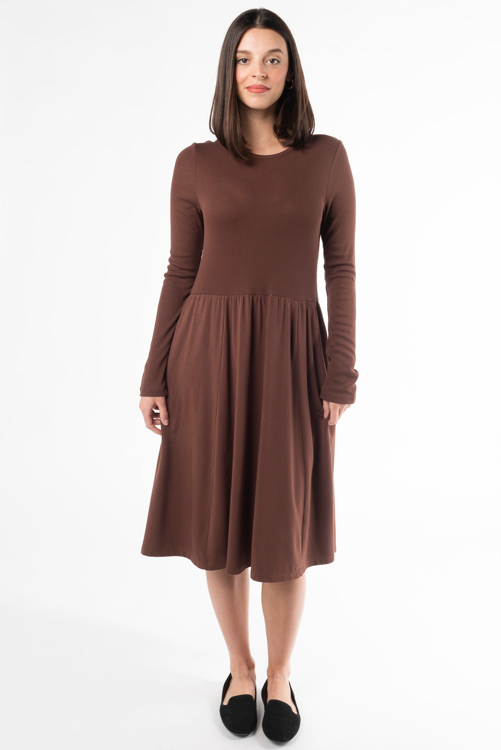 A woman modeling a long sleeve dress for fall. Made with bamboo fabric, a sustainable dress for women dress for women.