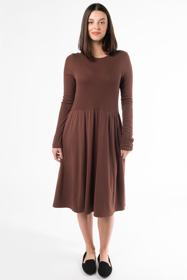 A woman modeling a long sleeve dress for fall. Made with bamboo fabric, a sustainable dress for women dress for women.