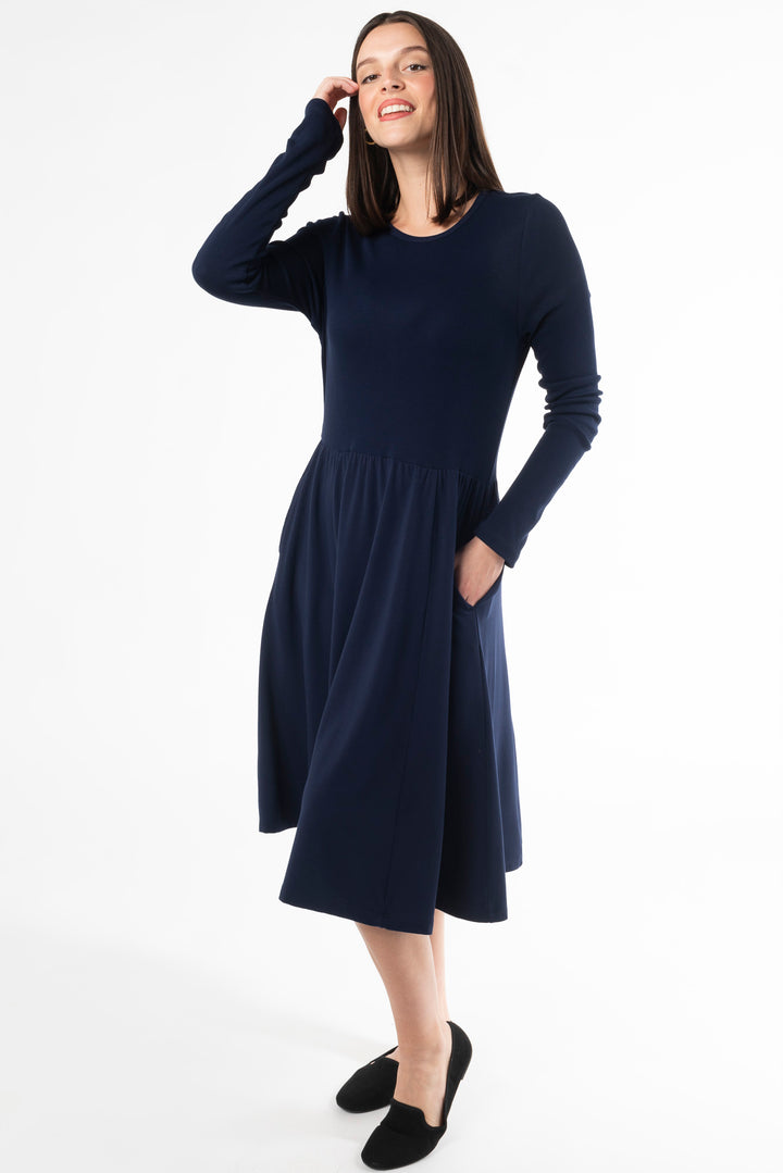 A woman modeling a long sleeve dress for fall. Made with bamboo fabric, a sustainable dress for women dress for women.