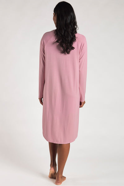 Back view of a woman wearing a Pink sleep dress made from sustainable bamboo.