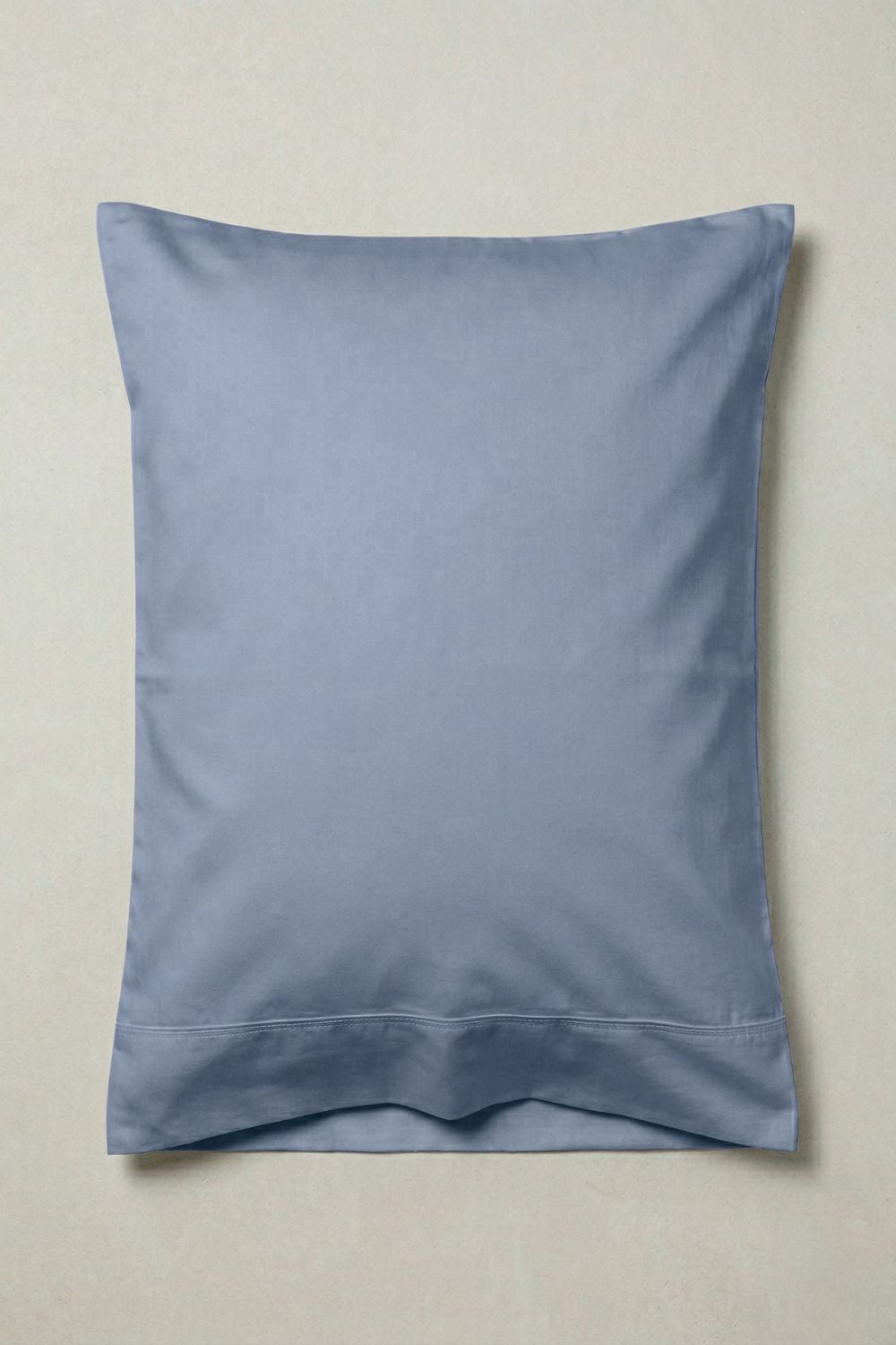 Blue pillow on a beige background