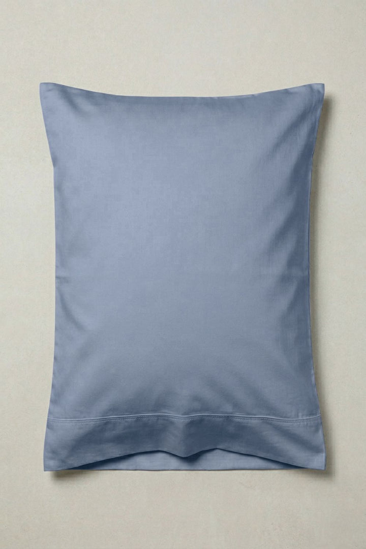 Blue pillow on a beige background