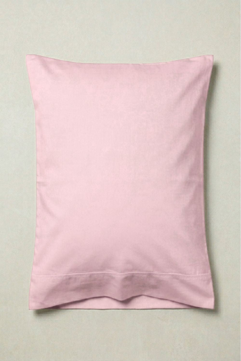 Pink pillowcase on a light gray background