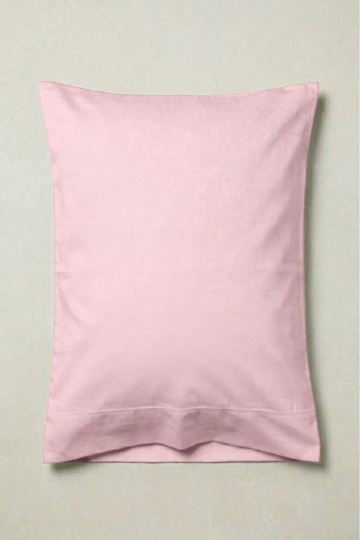 Pink pillowcase on a light gray background
