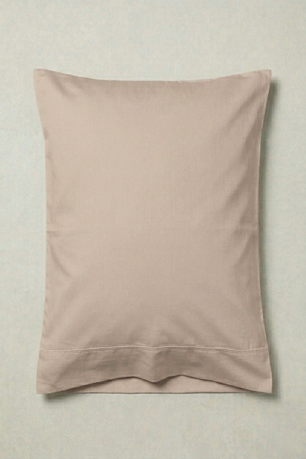 Earthy taupe pillowcase on a neutral background