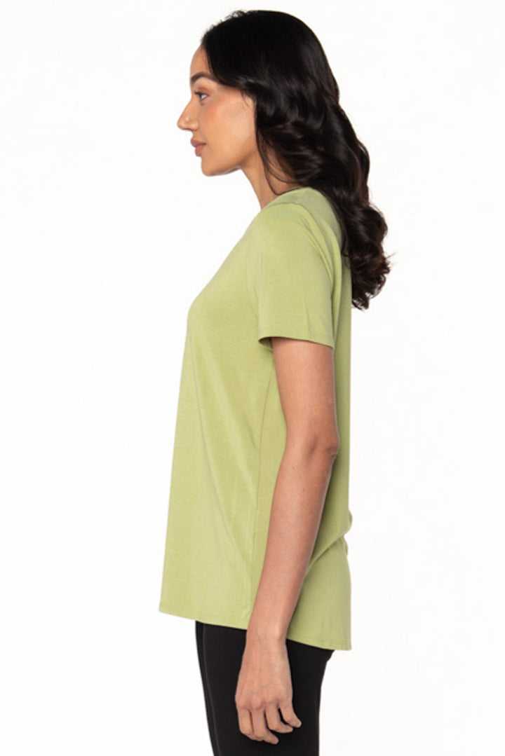 Model showing the side view of a light green short sleeve t-shirt made from bamboo.