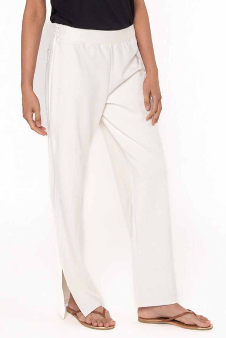 Cream coloured pants made with bamboo ponte. Features side slits at the ankle. 