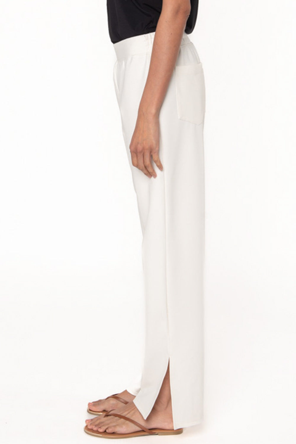 Bamboo ponte pant in cream colour with slit detail at the ankles. Elastic waistband comfortable pant for women.