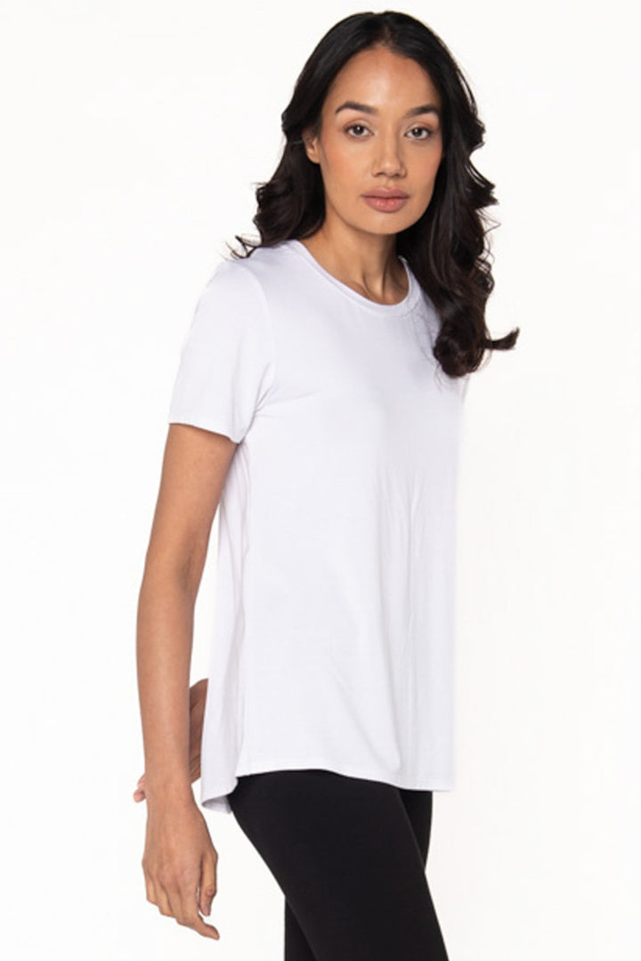 Model wears a white crewneck bamboo t-shirt by Terrera.