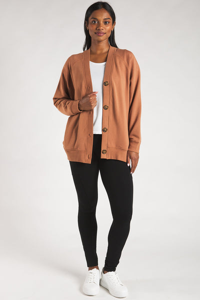 Woman styling the Terrera bamboo button-front cardigan with a t-shirt and bamboo leggings.