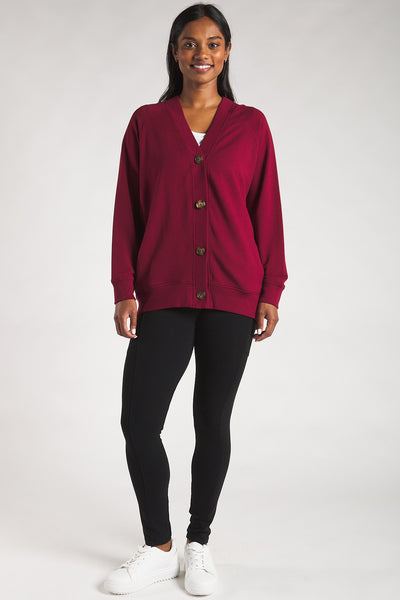 Woman styling the Terrera bamboo button-front cardigan with a t-shirt and bamboo leggings. 