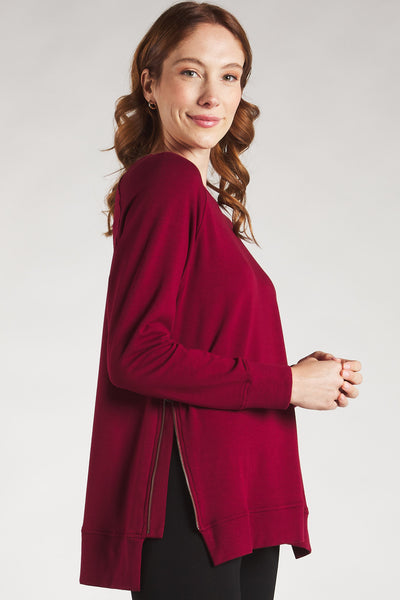 Closeup of the side zipper on the Terrera cranberry sweatshirt made from sustainable bamboo.