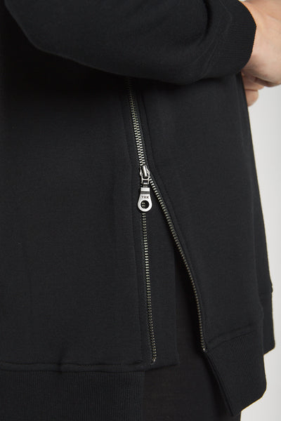 Closeup of the side zipper on the Terrera  black sweatshirt made from sustainable bamboo.