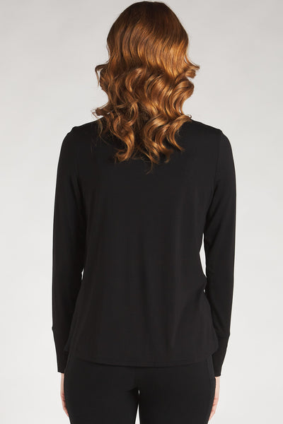 Back view of a woman styling a black long sleeve turtleneck top from Terrera. 