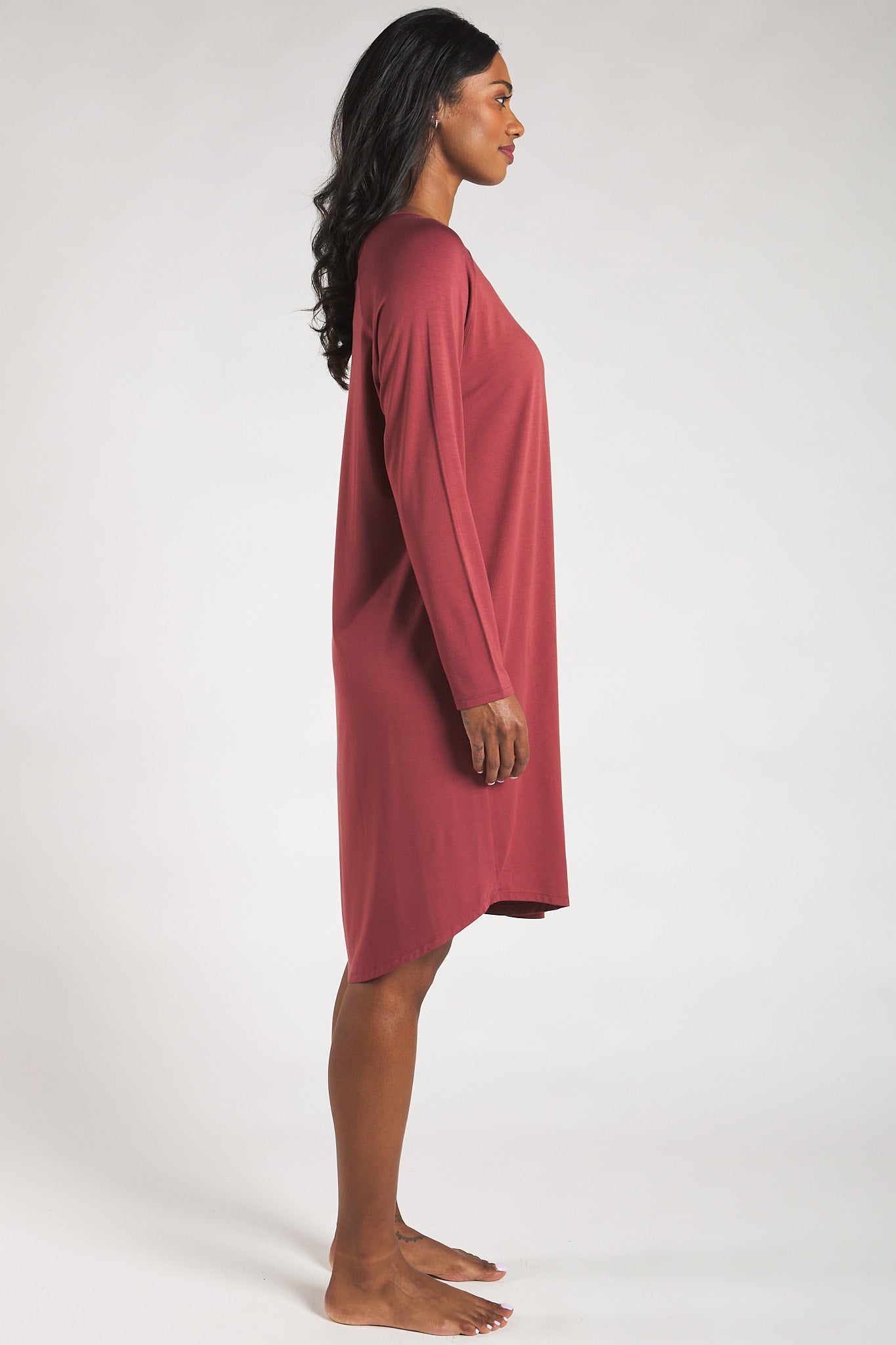 Side view of a woman wearing a soft Rosewood bamboo sleep dress from Terrera.