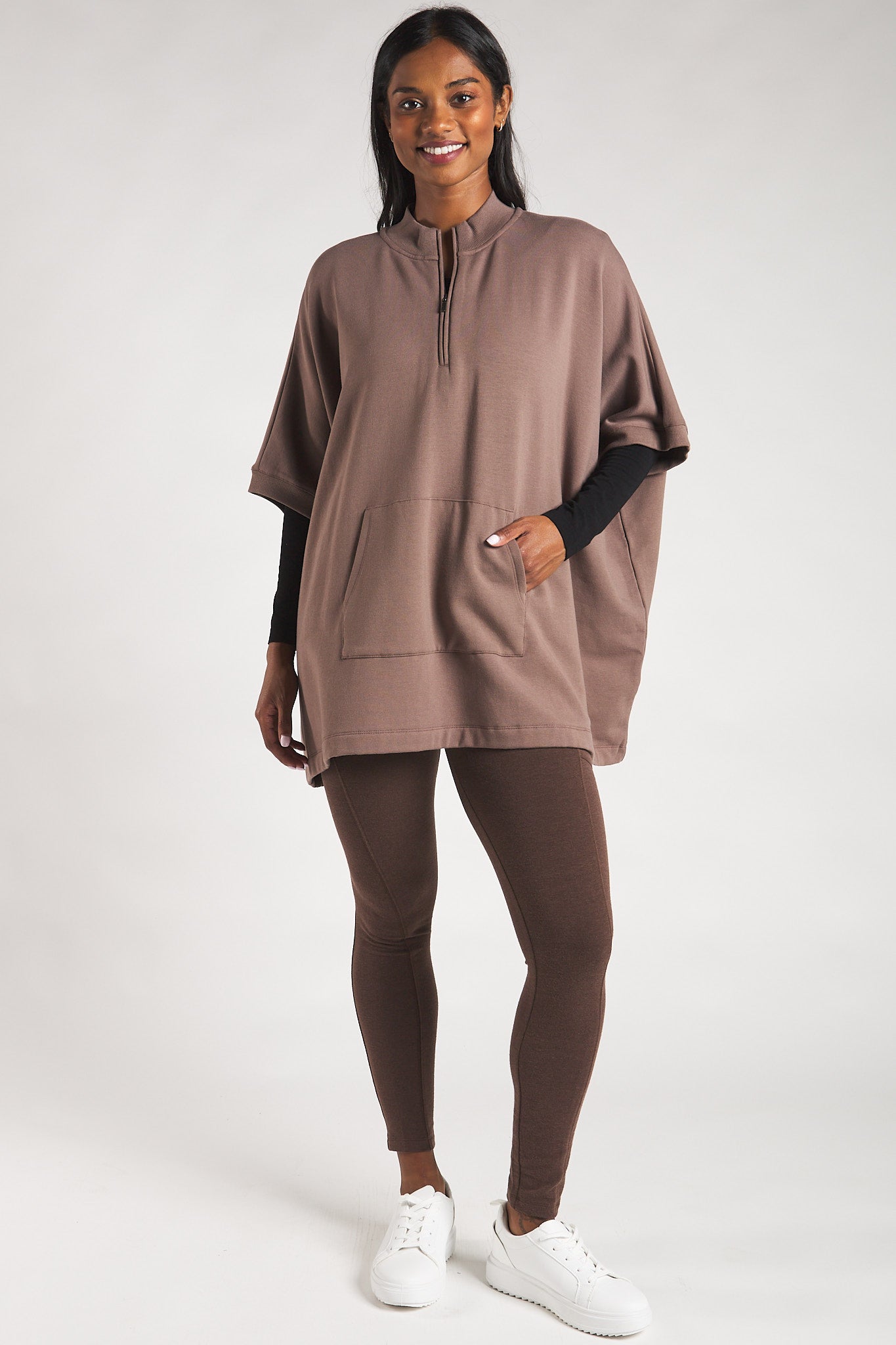  Women’s poncho sweater paired with sustainable bamboo leggings. 