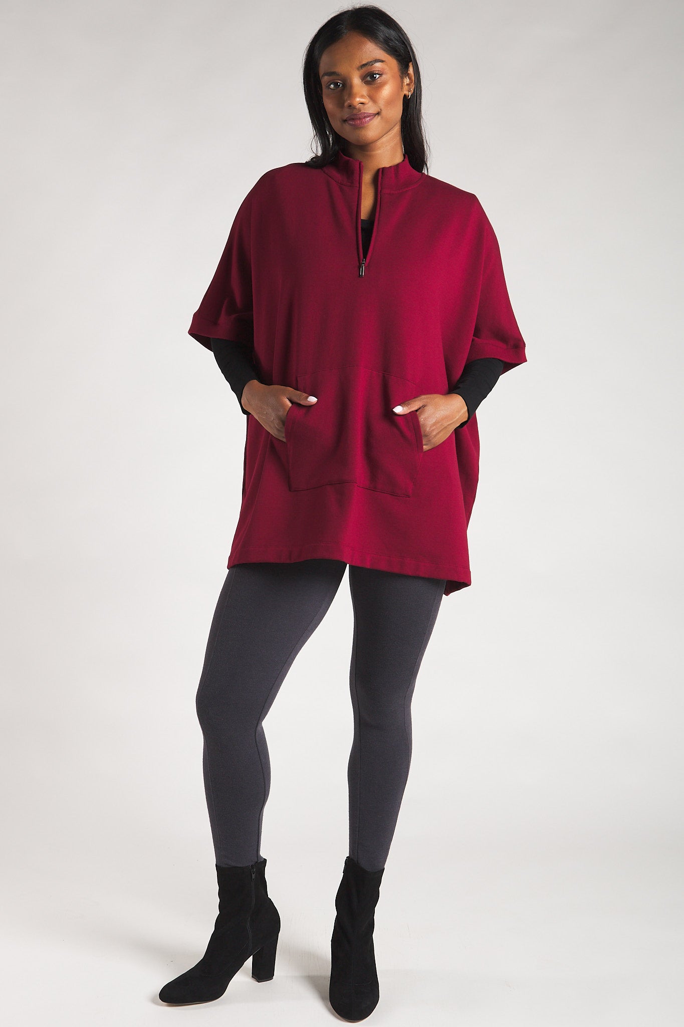 Women’s poncho sweater paired with sustainable bamboo leggings. 